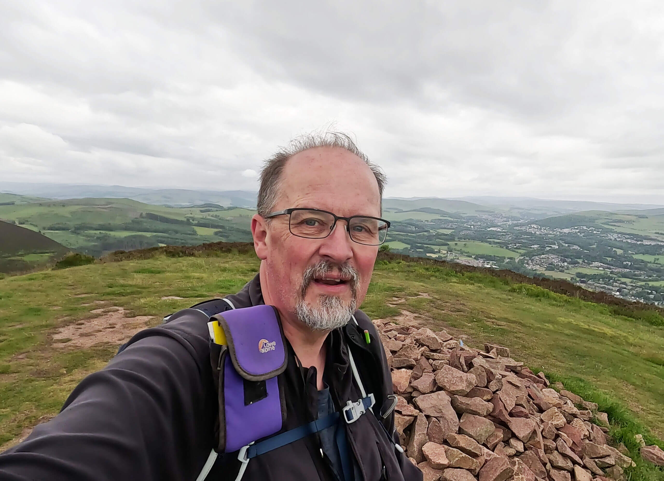 The commanding view of the surrounding landscape at the top of Eildon Hill North with Melrose in the valley below. This is the Highest point on Saint Cuthbert's Way.